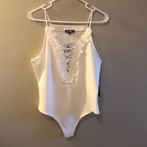 Brand new white low cut body suit